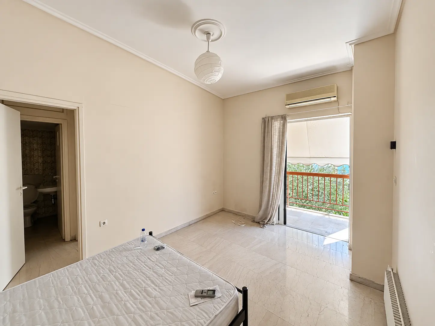 Apartment room opening onto balcony